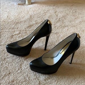 Black Michael Kors pumps with gold hardware detail